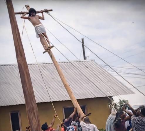 Panic at Easter Reenactment: Man Falls from Cross During Crucifixion Scene